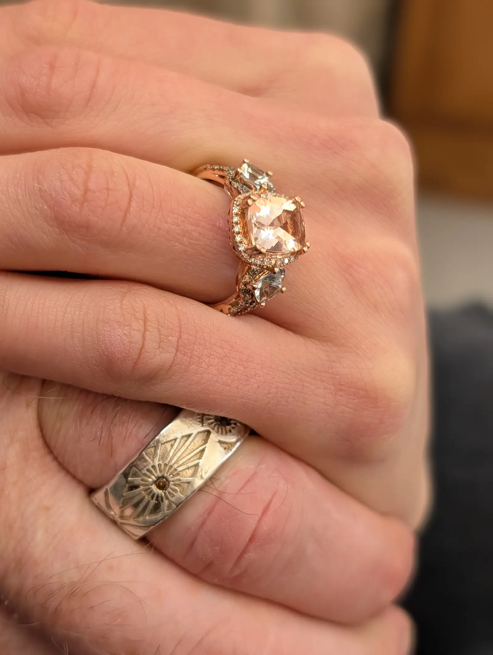 The engagement ring, hands intertwined
